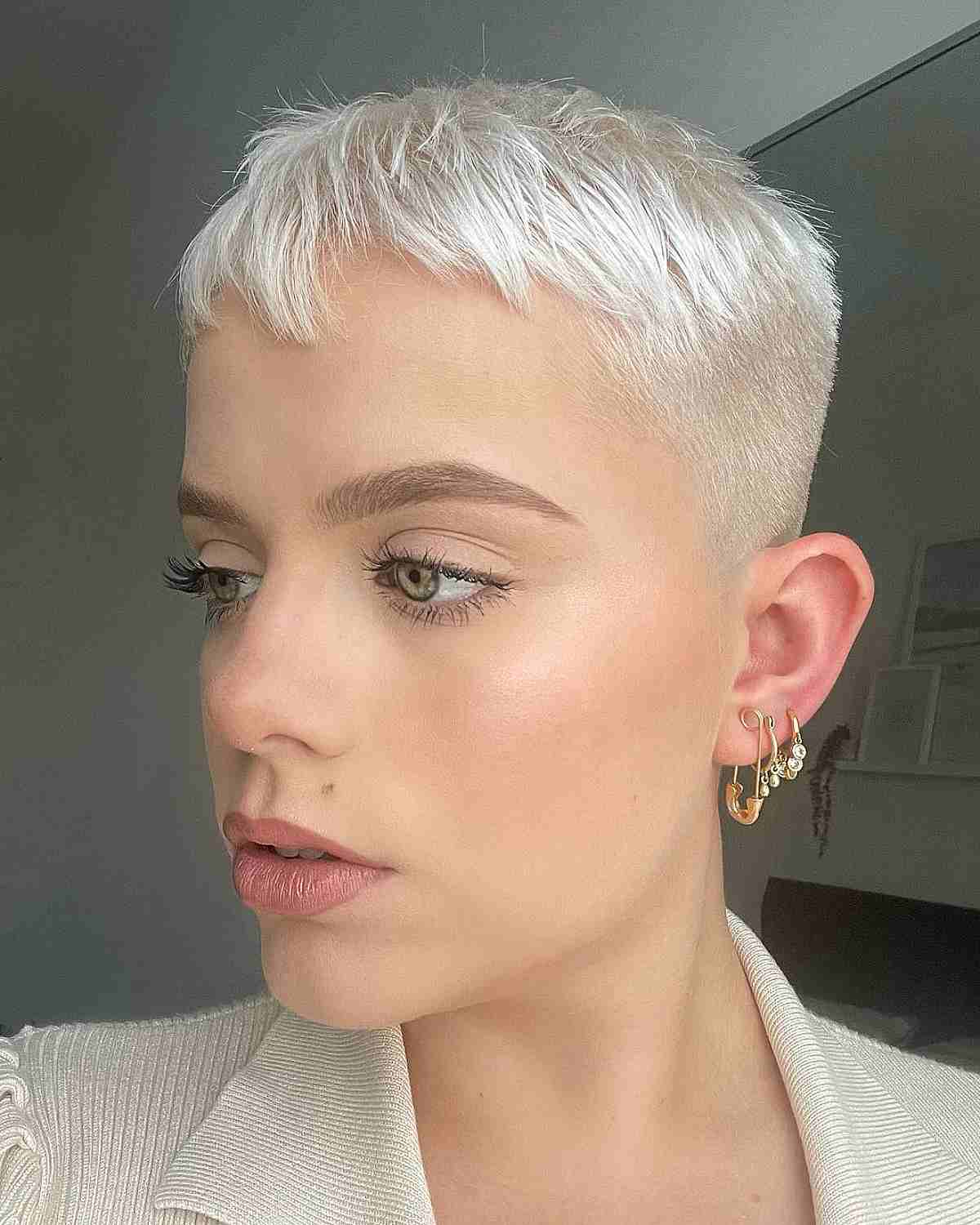 Very Short Icy Blonde Pixie Hair with Buzzed Sides