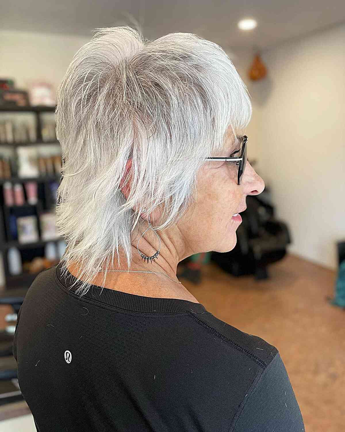 Very Short Shaggy Wolf Cut with Choppy Bangs on Older Women Aged 60 with Glasses