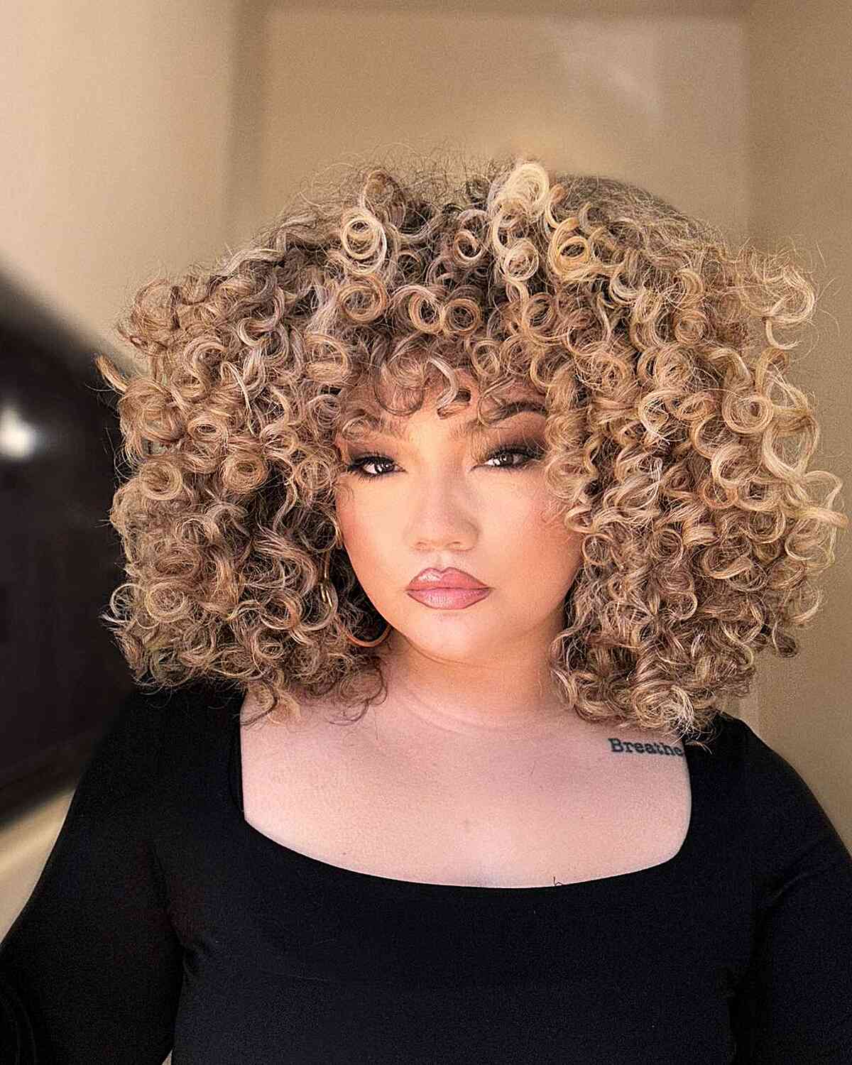 Very Thick Curls with Highlights for Round Face Shapes and prominent cheekbones