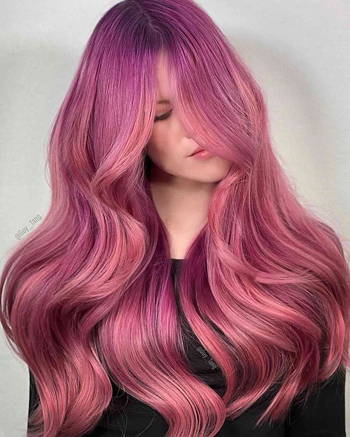 Vibrant Pastel Pink Hair Color for long thick hair with waves