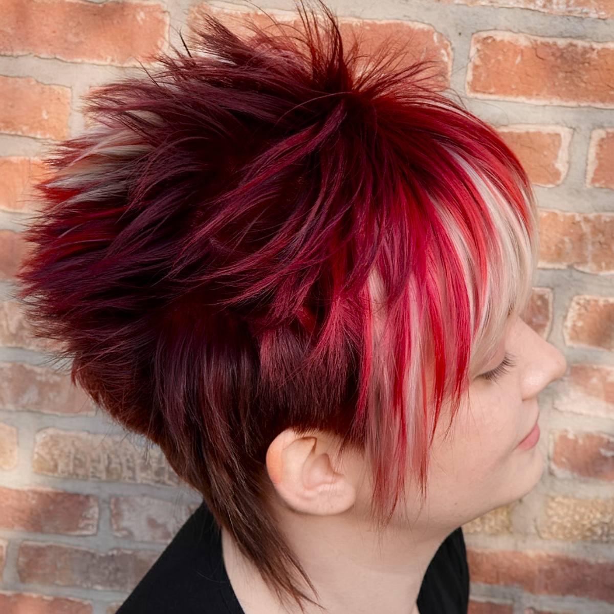 Red short spiky haircut with layered texture