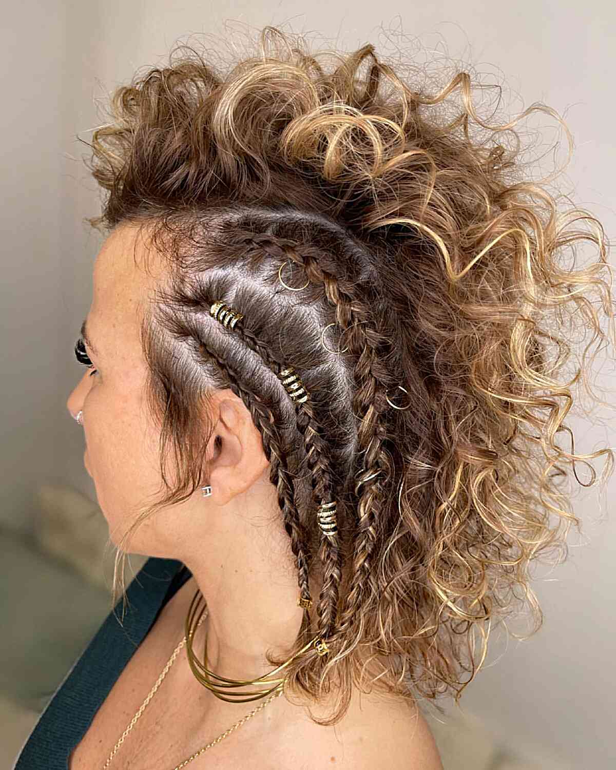 Viking-Inspired Curly Short Hair with Braided Side and Ring Accessories
