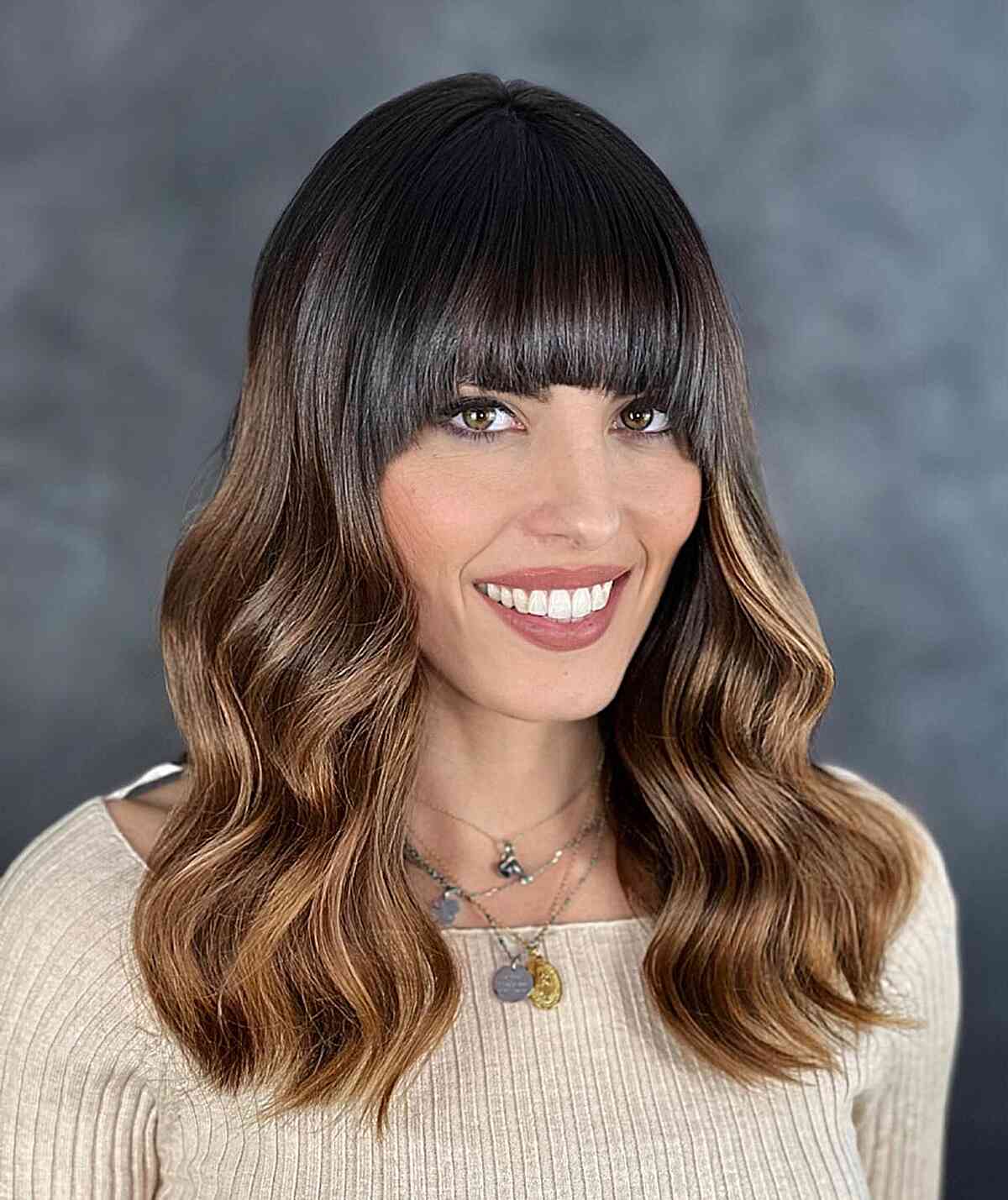 Vintage Allure with Thick Bangs for Medium Wavy Hair