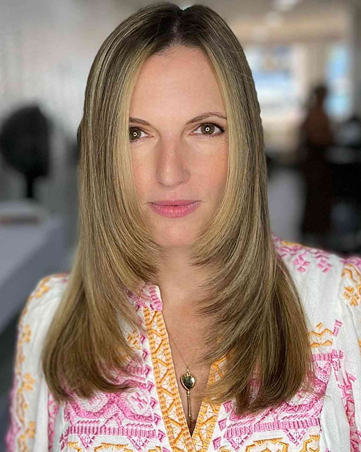 Visible Long Layers on a Mid-Length Cut for Big Foreheads