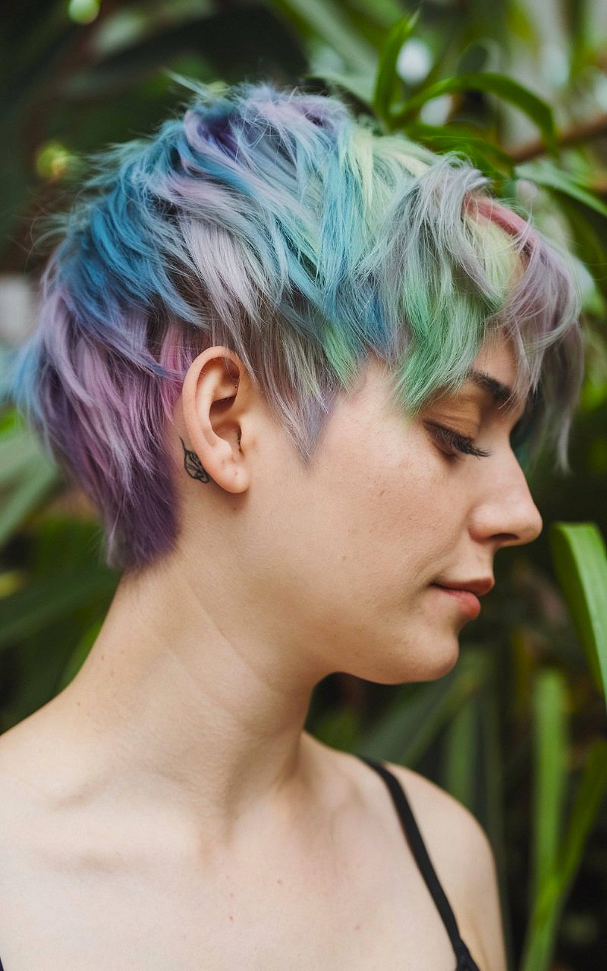 Vivid rainbow-colored pixie cut with choppy layers for short hair