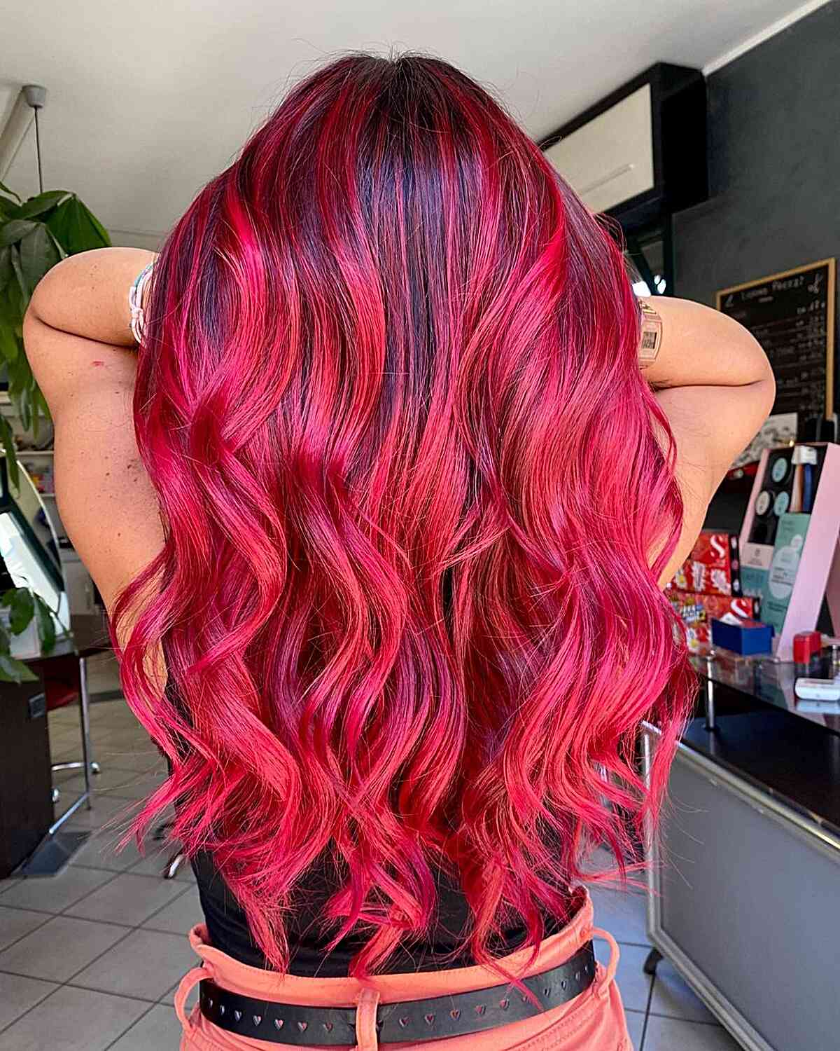 Vivid Red Balayage with Dark Roots for women with long wavy hair