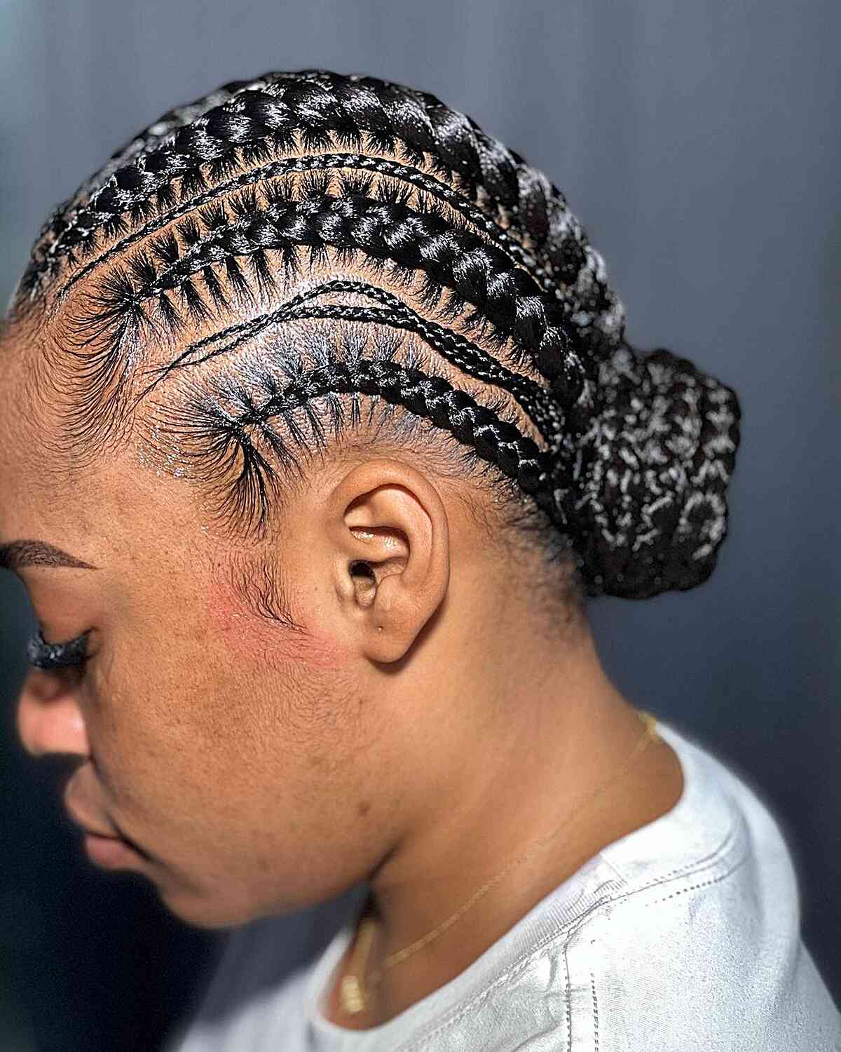 Volleyball Inspired Cornrow Braids with Low Bun for Black Women