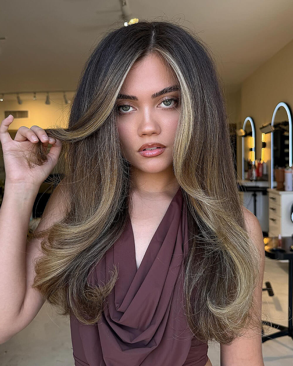 Voluminous bronde layers with face-framing highlights on long hair for a dimensional bronde hair color look
