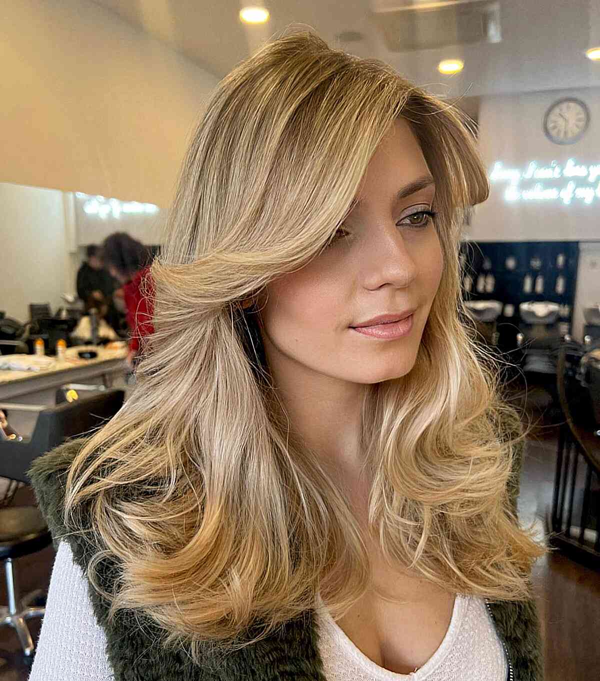 Mid-Length Voluminous Butterfly Blonde Hair with Face-Framing Bangs
