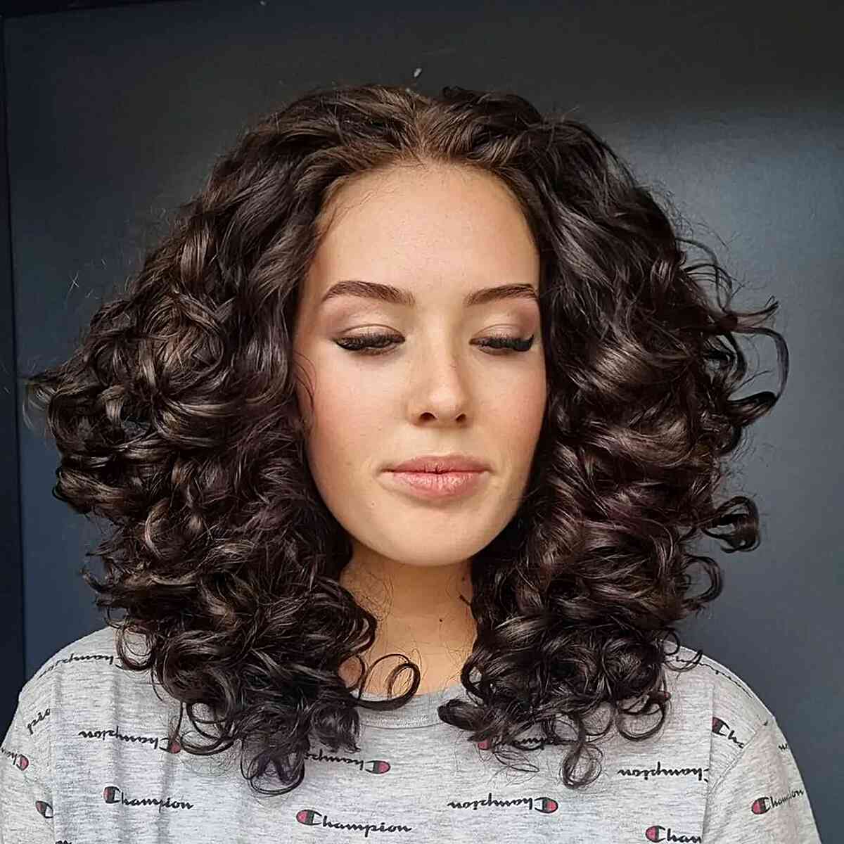 Voluminous Dark Brown Curls with Layers for ladies with medium-length hair