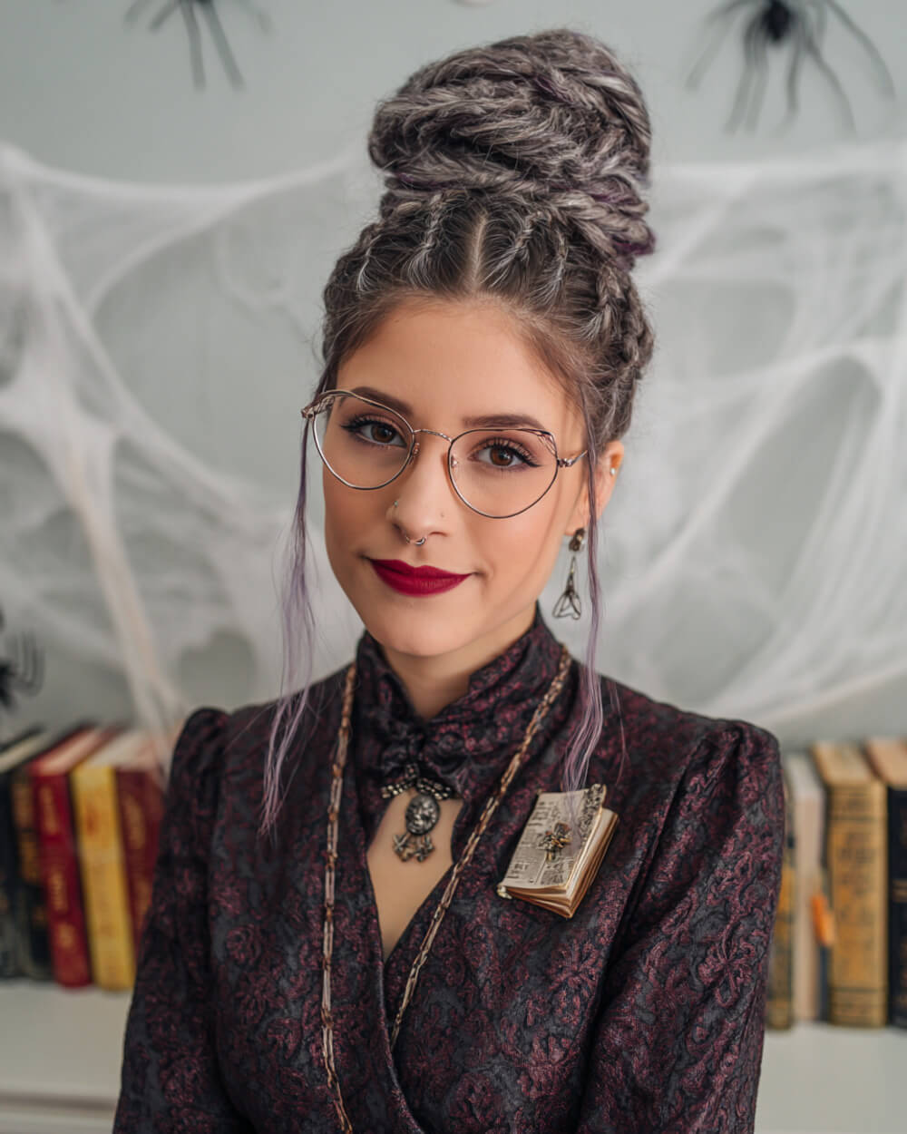 High bun with dreaded texture and silver highlights, witchy Halloween hairstyle