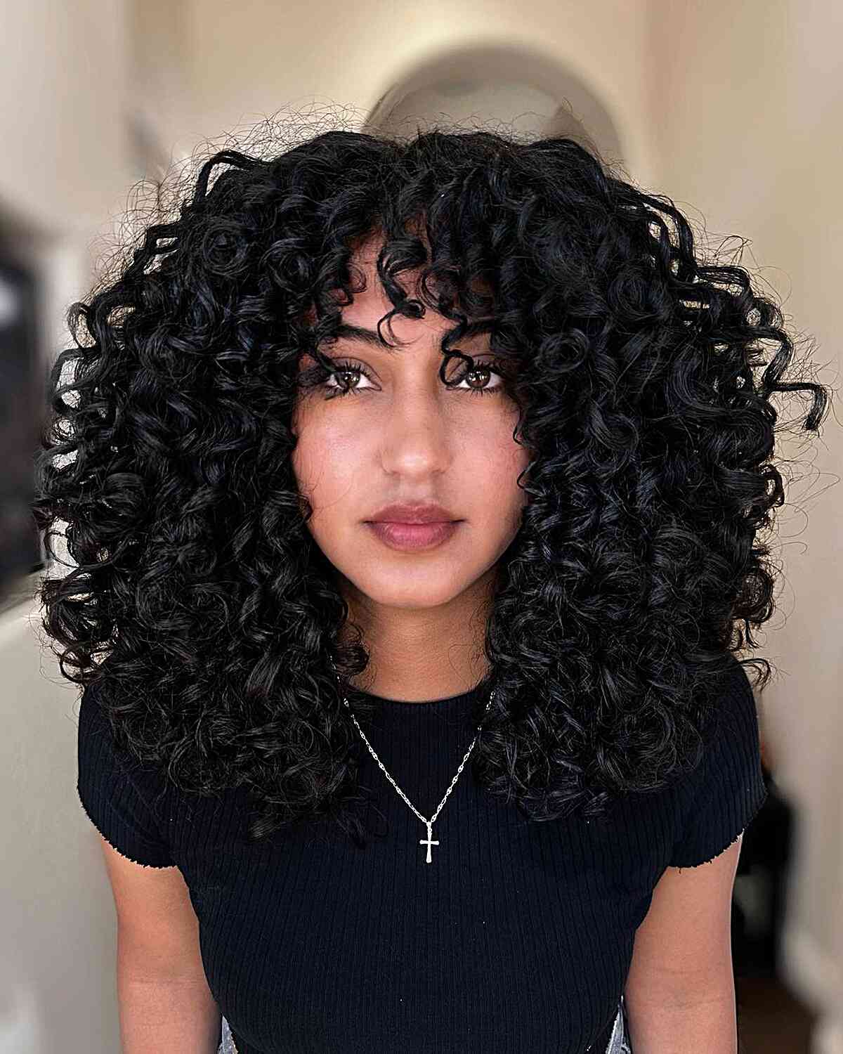 Voluminous Jet Black Curly Hair with Bangs for ladies with thick hair