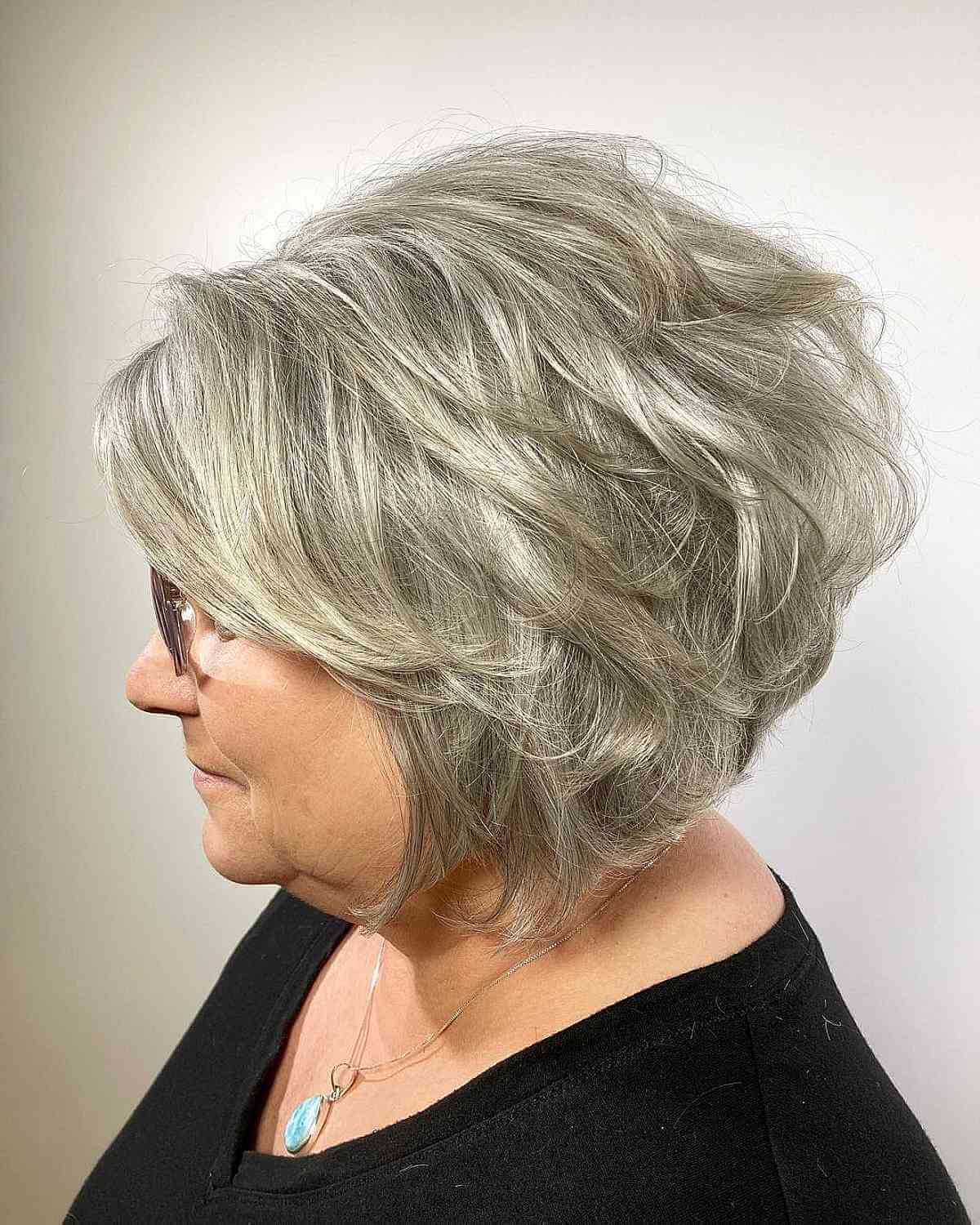 Voluminous Salt-and-Pepper Short Bob for Ladies Over Sixty with Round Faces