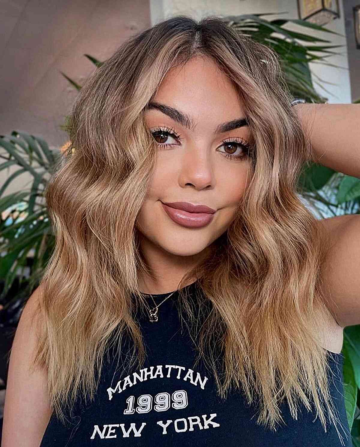 Warm Blonde Balayage Middle-Parted Hair with Choppy Ends 