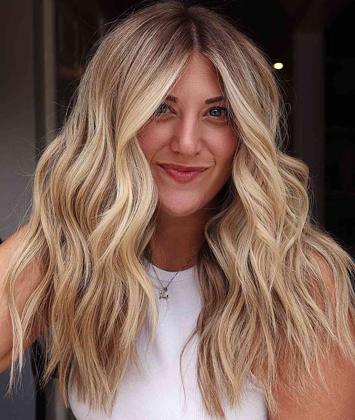 Warm Rooted Buttery Blonde Balayage with Choppy Haircut