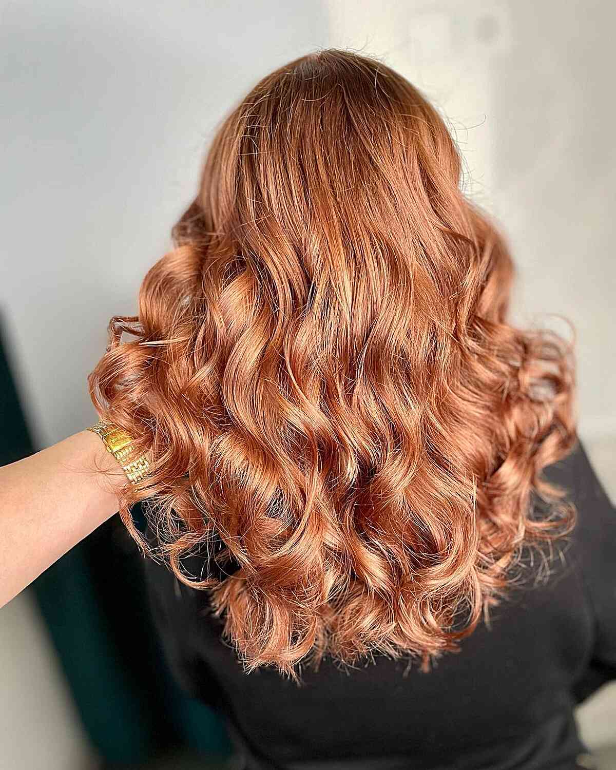 Full Warm Rose Gold Highlights for Medium-Length Loose Curly Hair