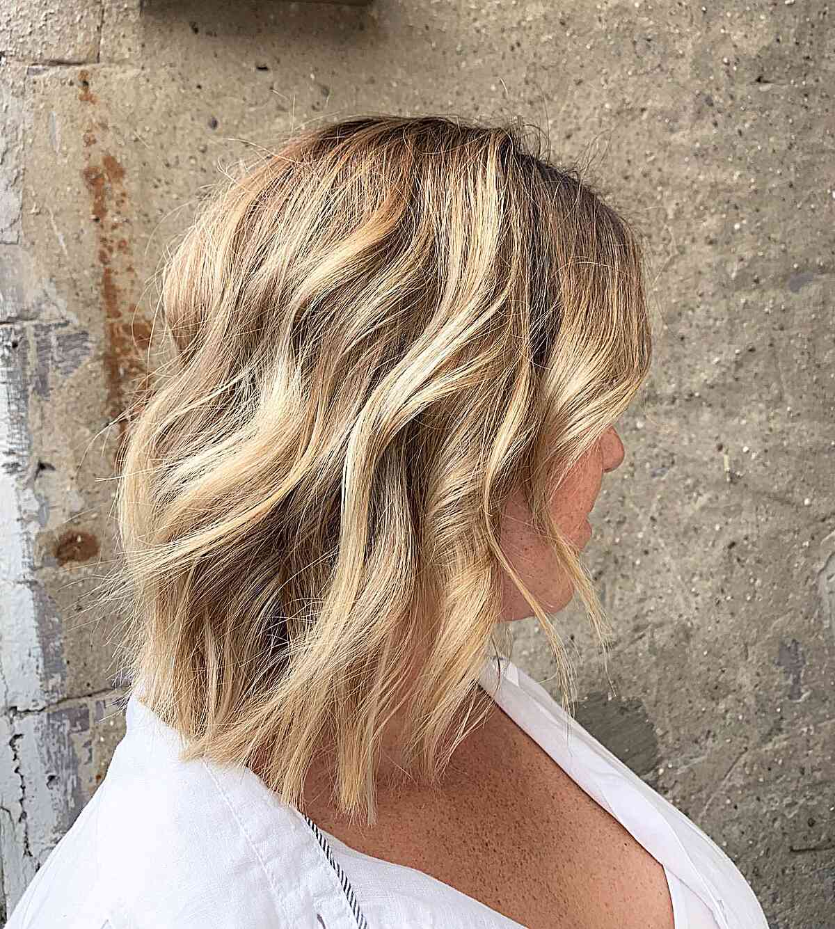 Warm-Toned Dirty Blonde Balayage with Root Smudge for Short Choppy Hair