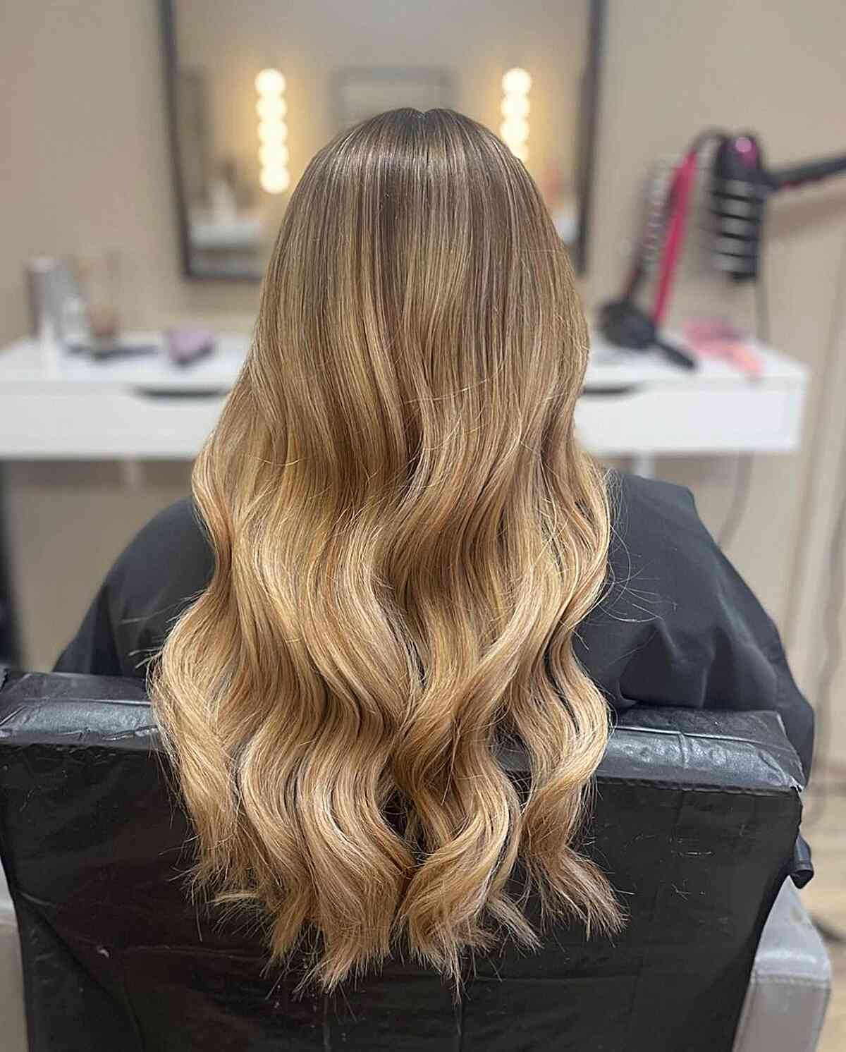 Warm-Toned Soft Bronde Foilayage with Root Melt for Long Tresses