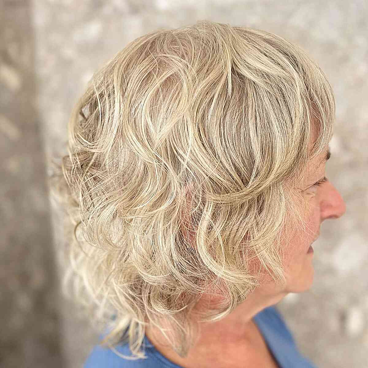 Neck-Length Wavy Blonde Razor Cut Shag on Old Woman's Thin Hair