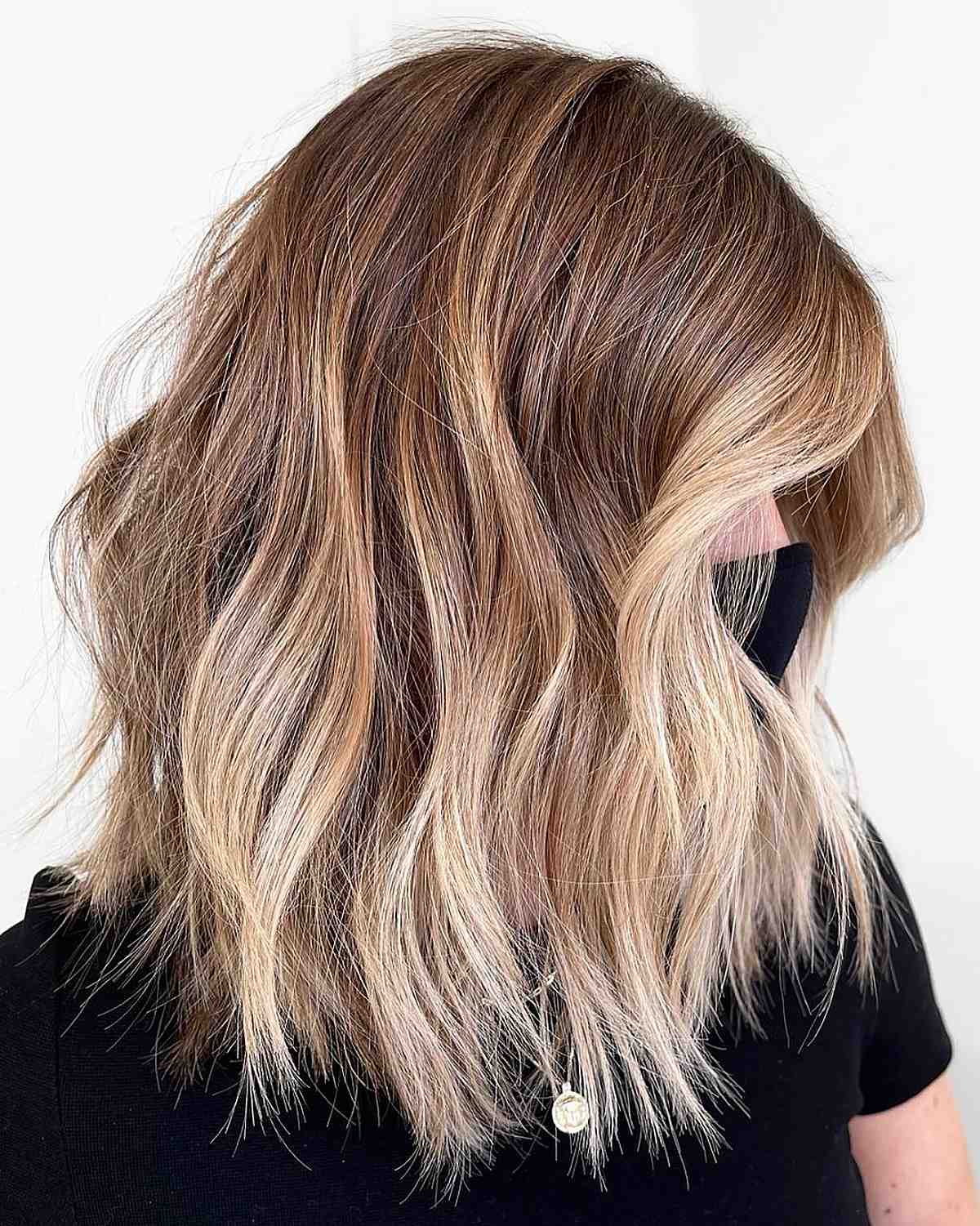 wavy hair with champagne blonde highlights