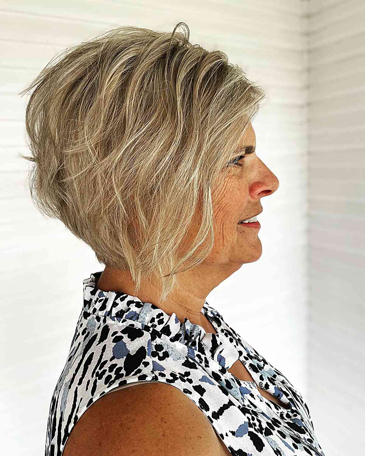 Wavy Inverted Haircut with Piece-y Layers on a Short Wispy Bob of women aged 50