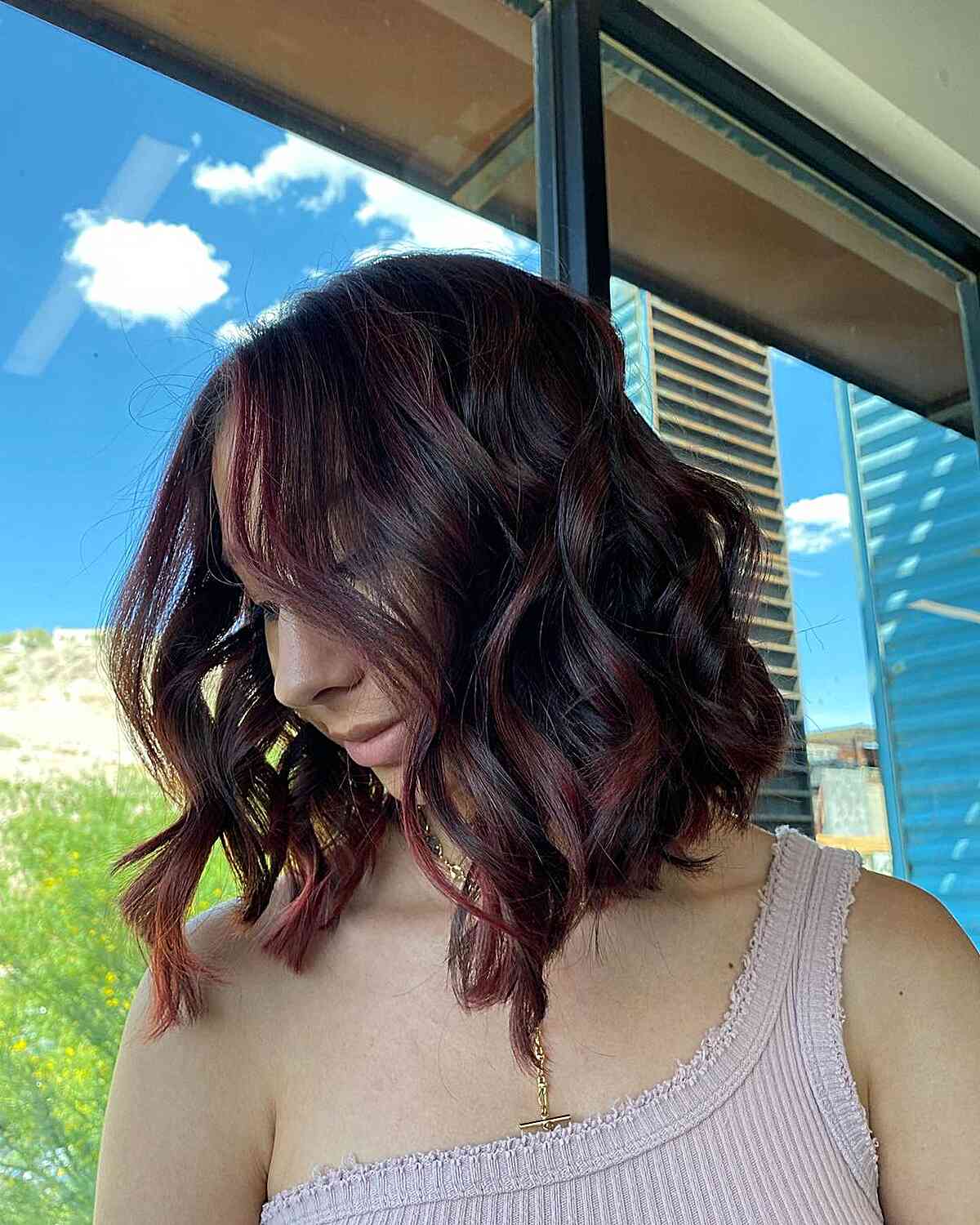Wavy Lob with Subtle Burgundy Highlights for Dark-Haired Women