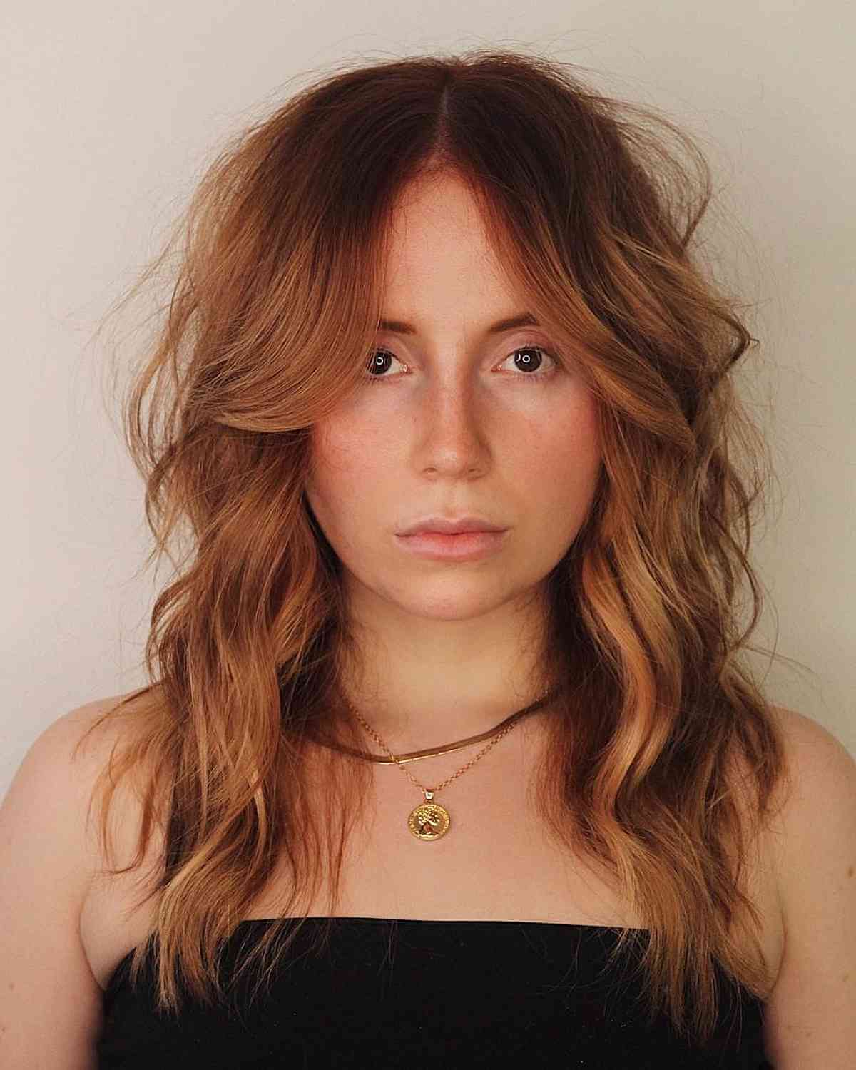 Wavy Modern Shag with a Middle Part and Bangs