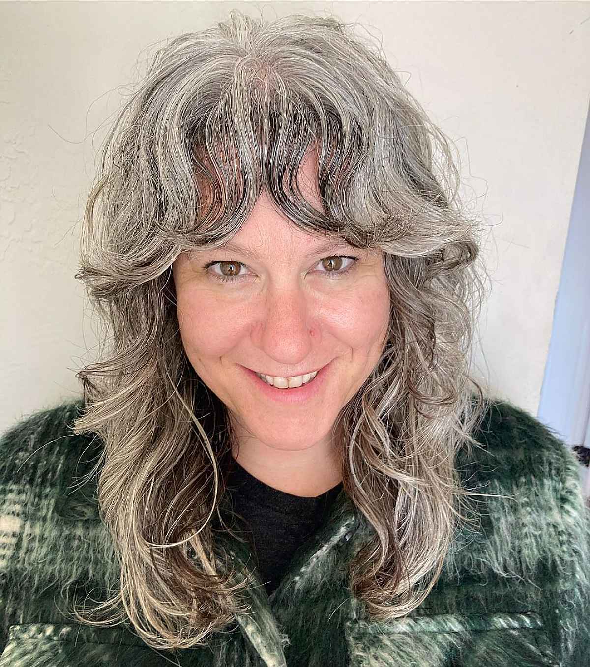 Wavy Shag for Women Over 50 with Silver Hair