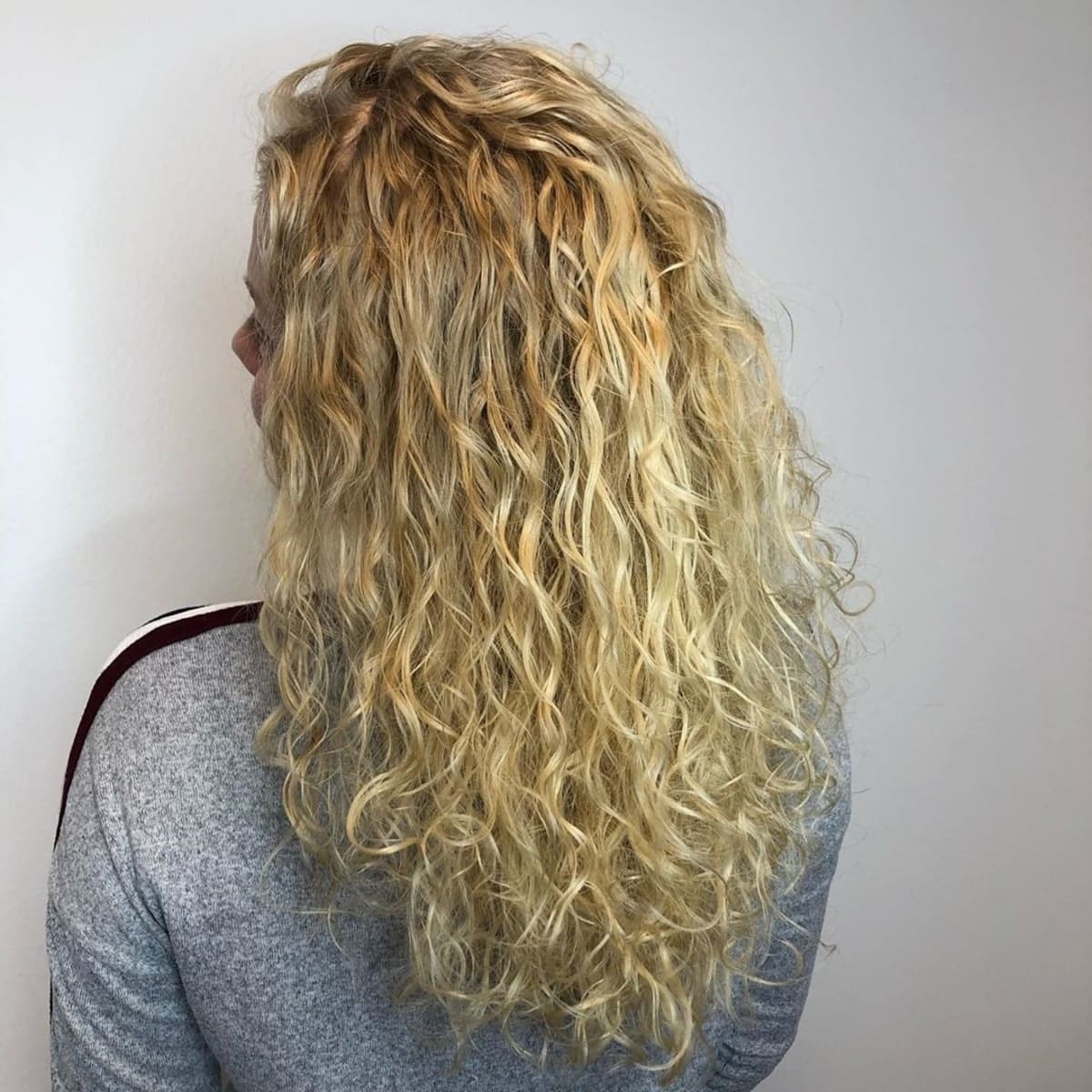 wavy spiral perm on blonde hair