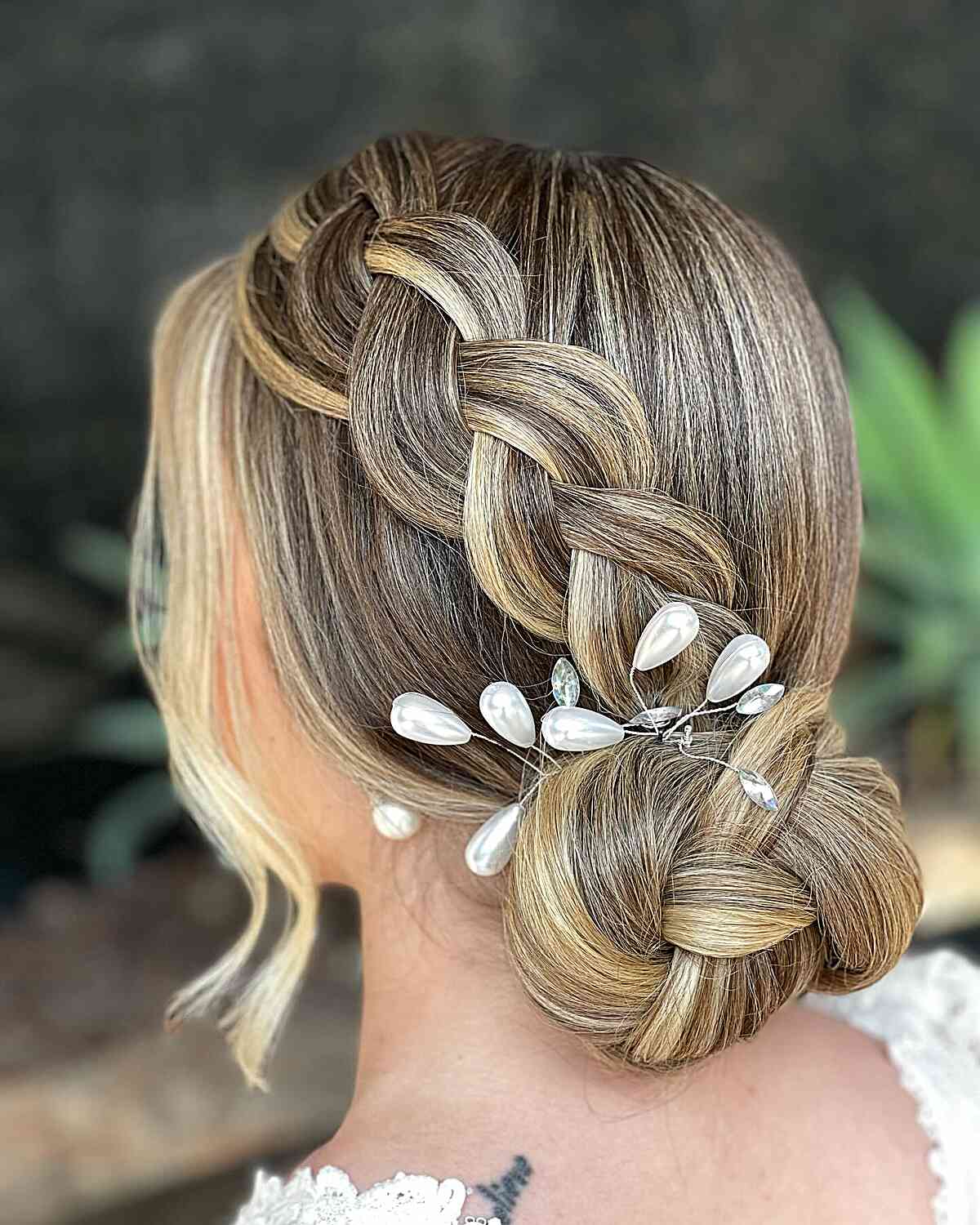 Wedding Low Bun Updo with a Dutch Braid and Accessories