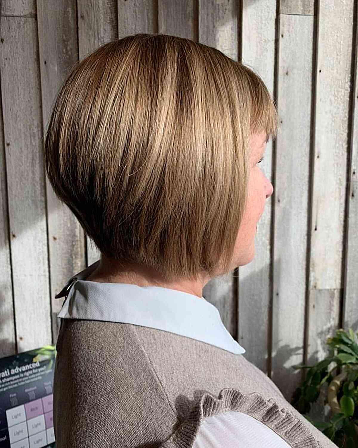 Wedged Concave Bob with Caramel Highlights for older women