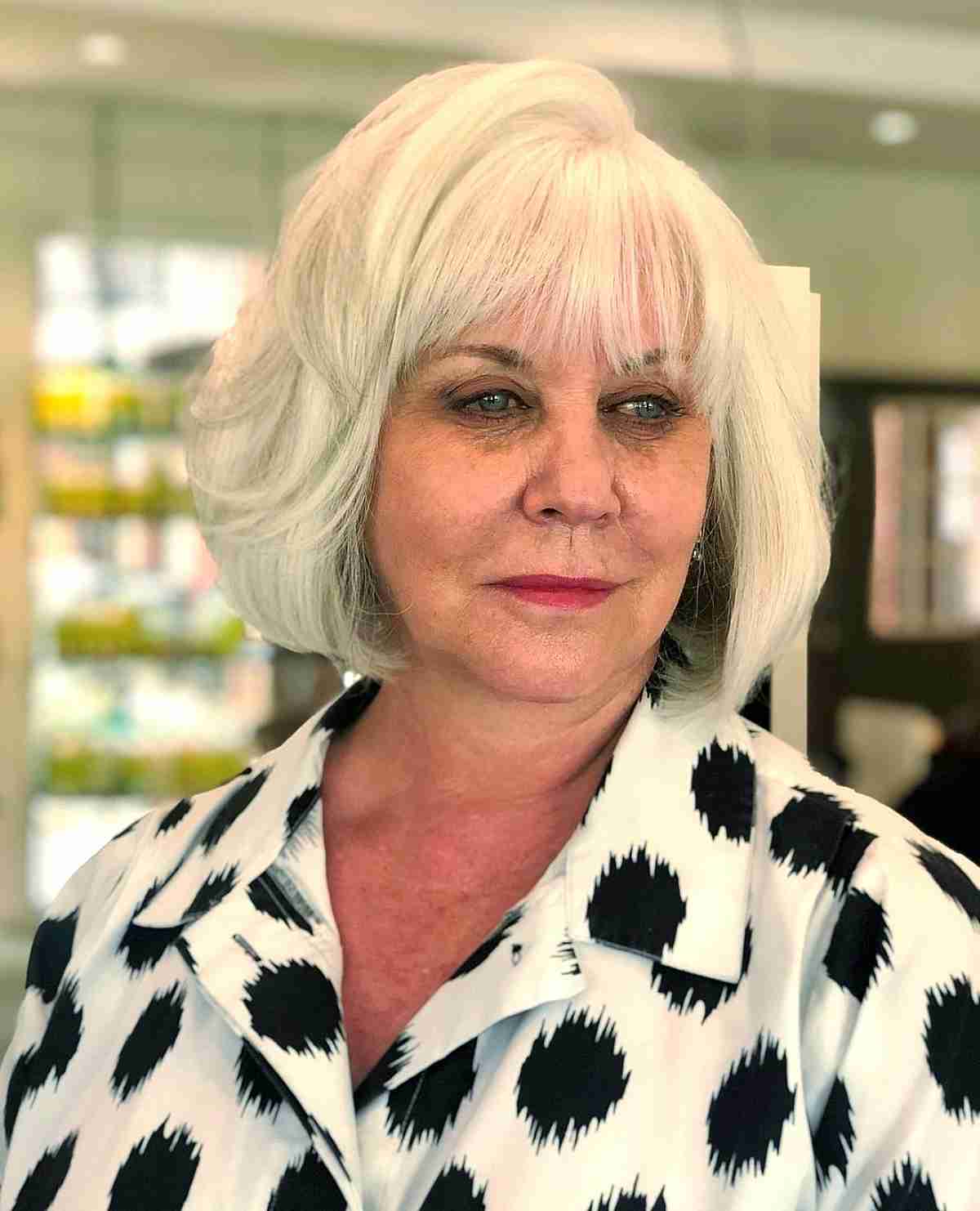 White Chin-Length Bob with Light Bangs for a 50-Year-Old