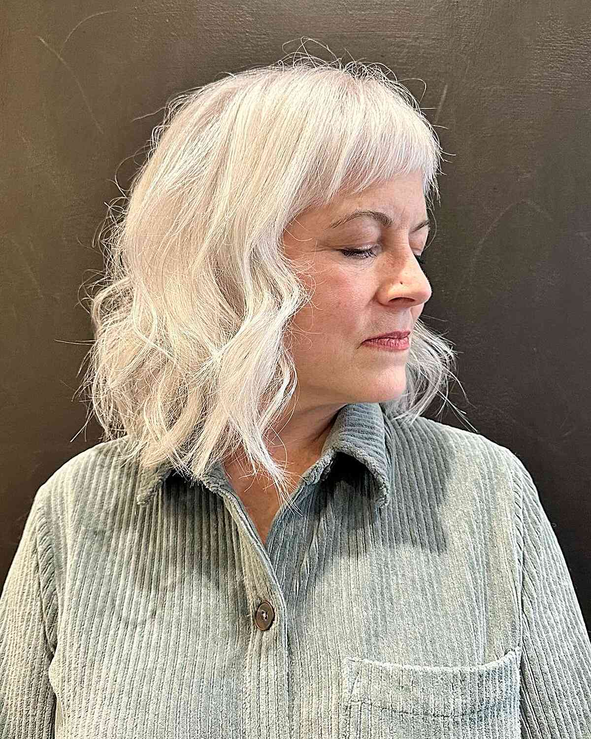 White Thin Hair with Short Curved Bangs for women over 60 with messy hair