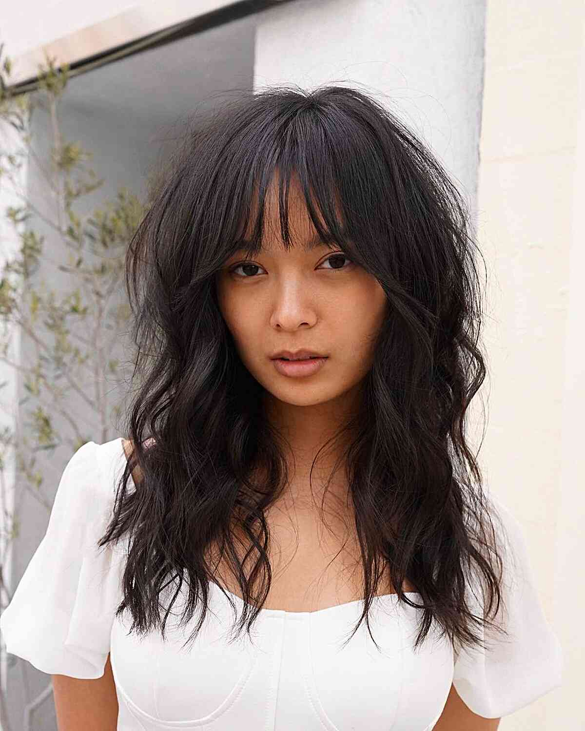 Wispy and Textured Hairstyle with Wispy Bangs