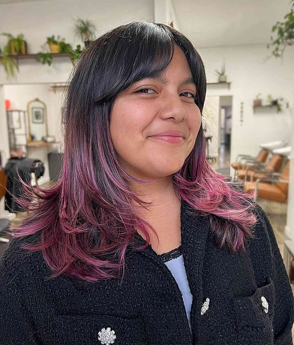 Wispy Layers and Bangs and curtain bangs on long hair with pops of pink highlights at the ends for round faces