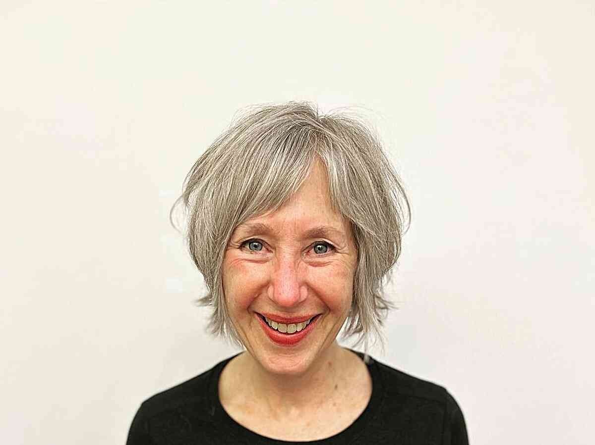 Wispy Natural Silver Hairstyle for Older Women with Long Faces