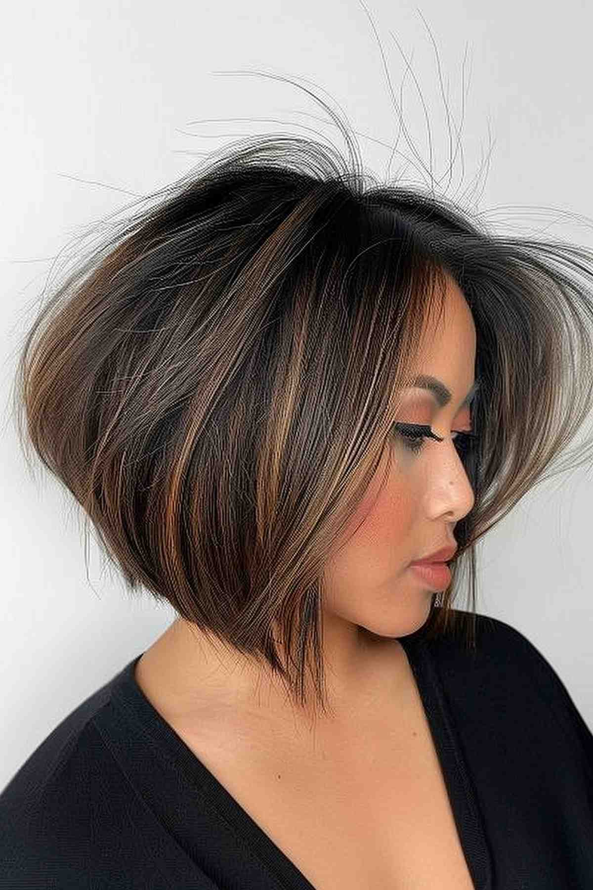 Stylish woman with dramatic highlighted angled bob hairstyle