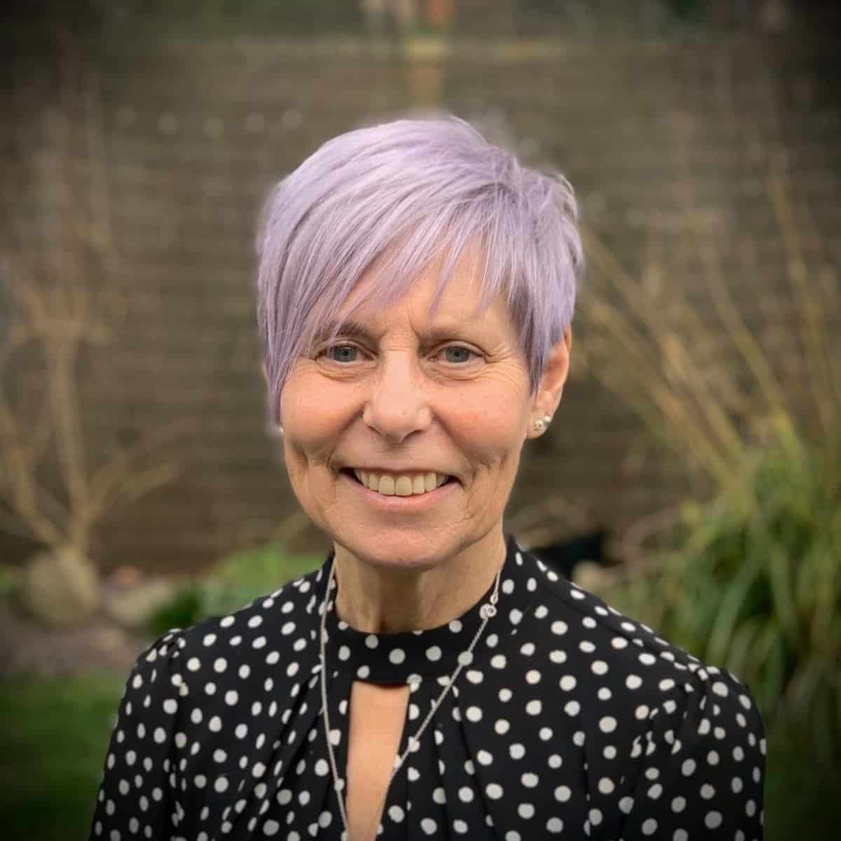 Woman over 60 with a Purple Pixie and Bangs