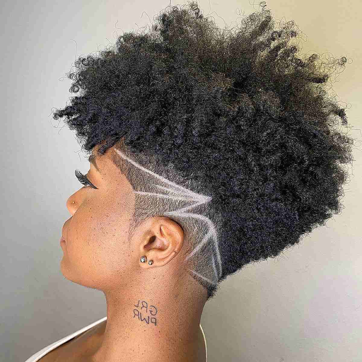 Women's curly frohawk with tapered sides