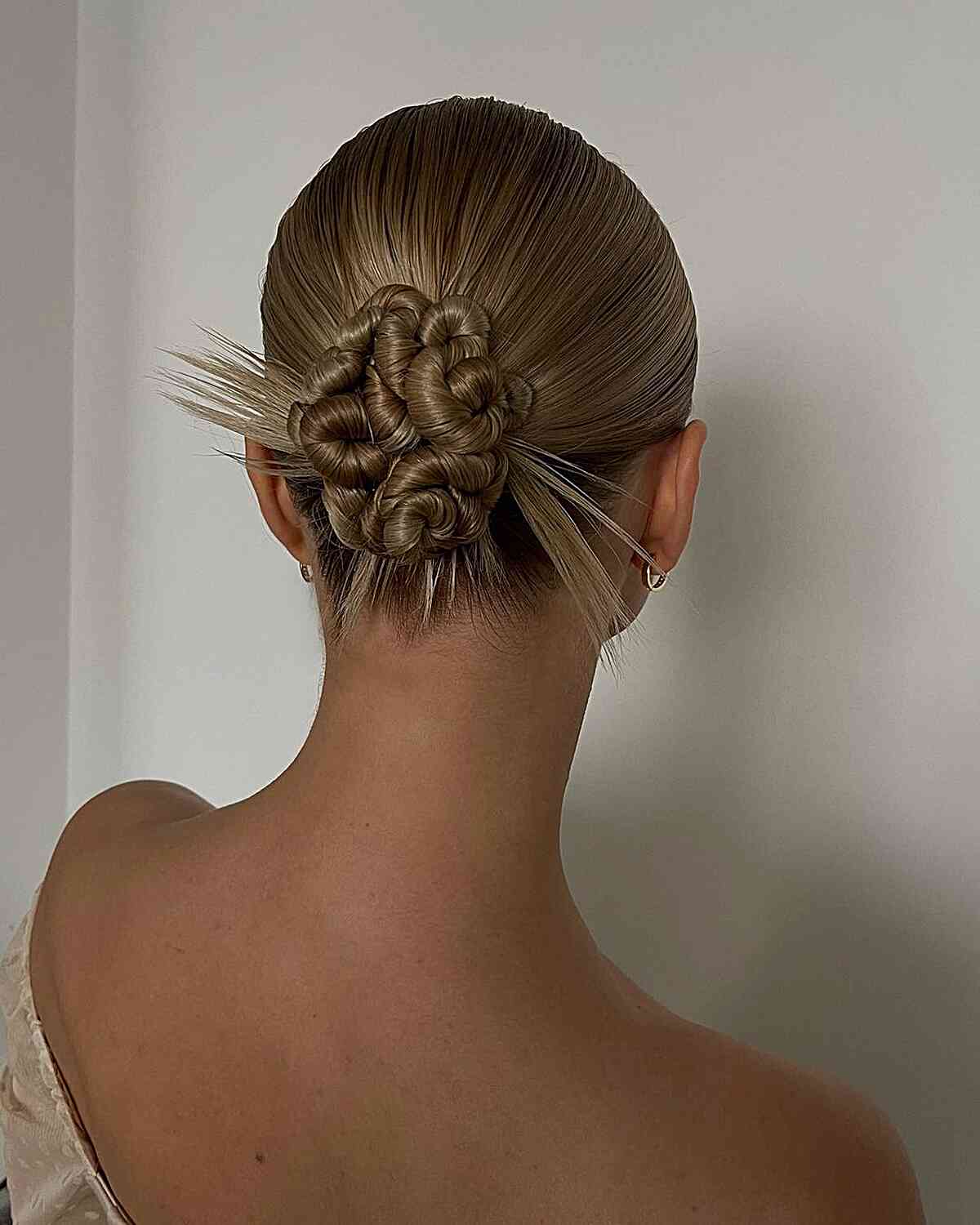 Y2K Sleek Low Updo with Swirls and Spikes for Straight Blonde Hair