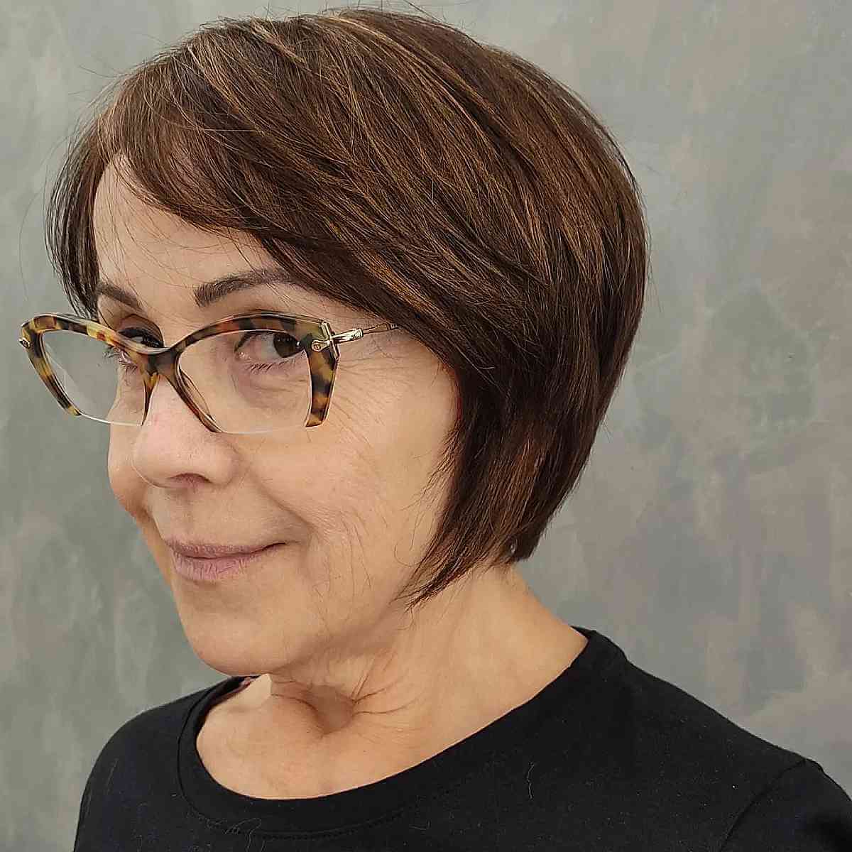 Youthful Side-Swept Bob Cut for a 60-Year-Old with Glasses