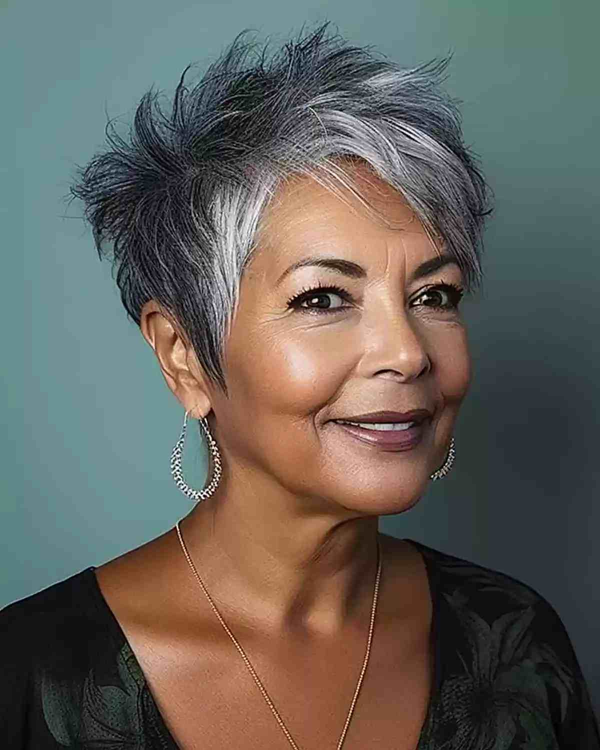 Youthful Spiky Pixie Cut with Grey Balayage for a Woman Aged 60